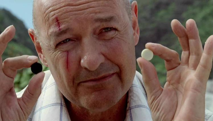 John Locke from LOST holding up Backgammon pieces